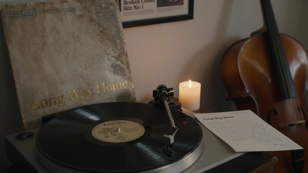 A vinyl record of 'Long Way Home' spinning beside a candle and cello, with a fan's letter on the table.