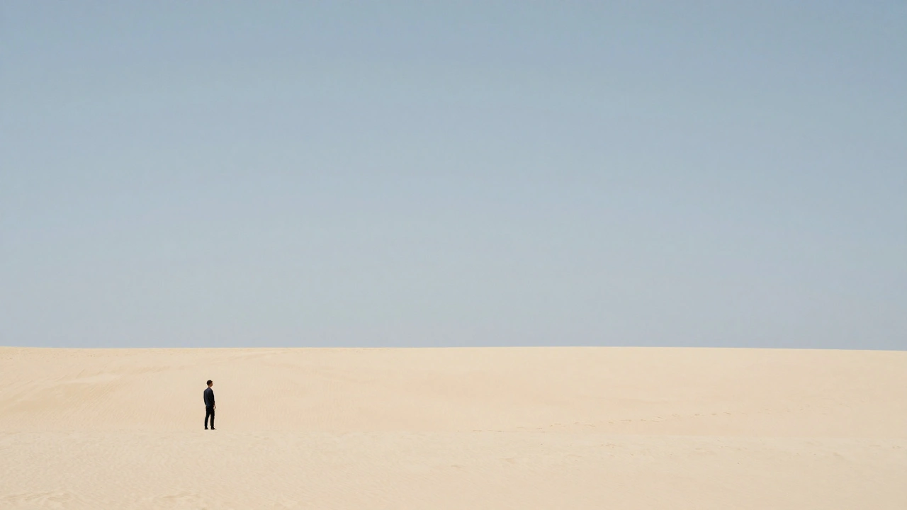 Small human figure positioned far left in wide desert horizon.